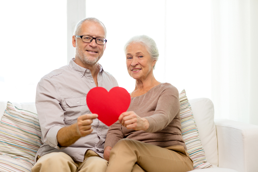 Couple with paper valentine heart